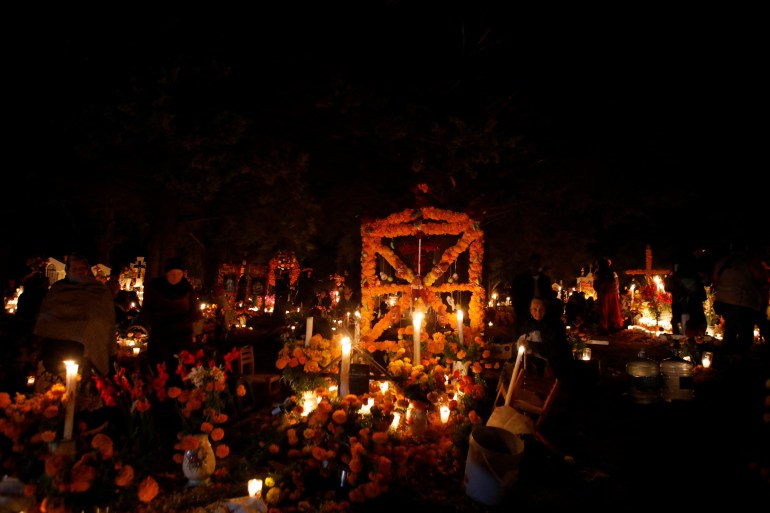People celebrate the Day of the Dead at a cemetery in the Purepecha indigenous community of Cucuchuchu