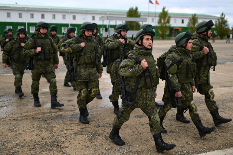 Russian reservists recruited during the partial mobilisation of troops attend a ceremony before departing to the zone of Russia-Ukraine conflict, in the Rostov region