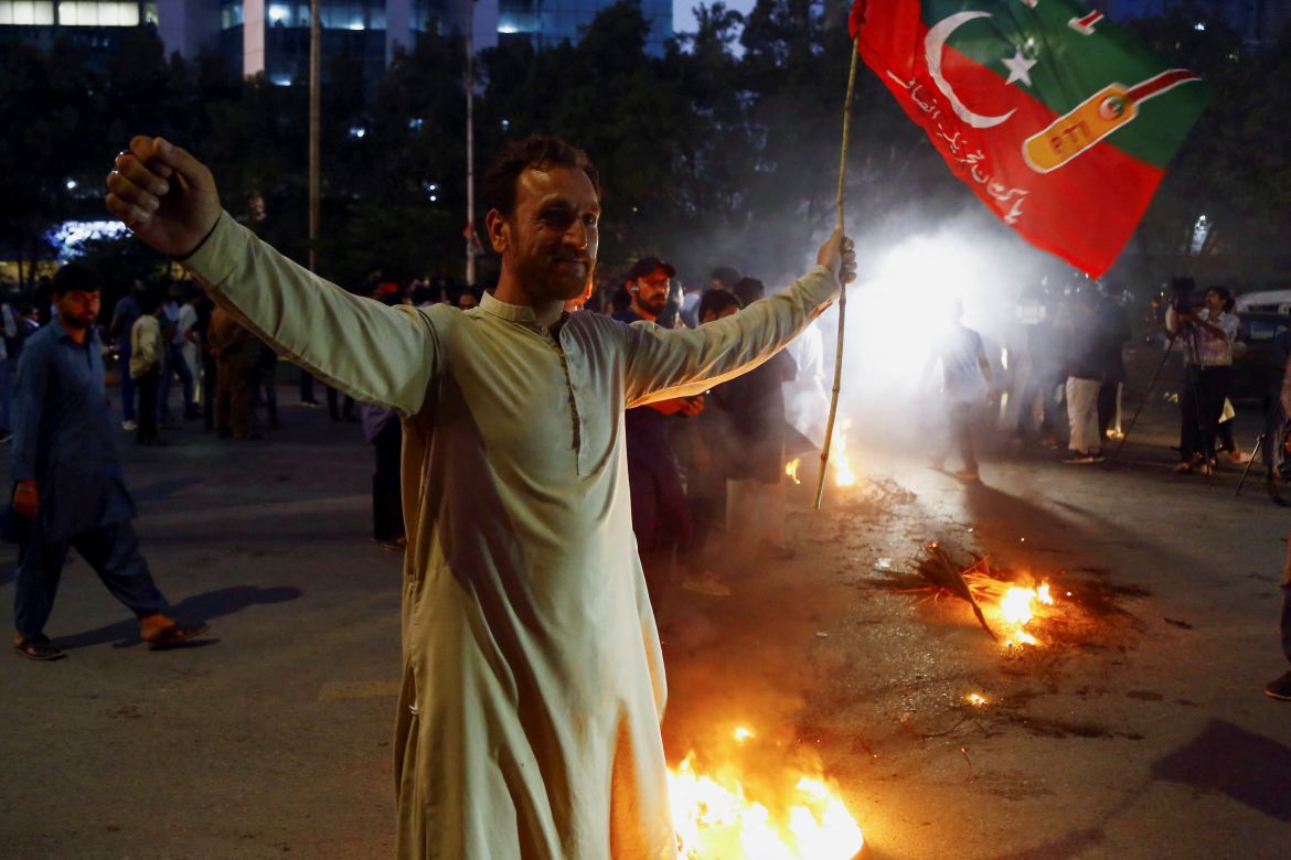 A supporter of Pakistan former Prime Minister Imran Khan, gestures following the shooting incident.