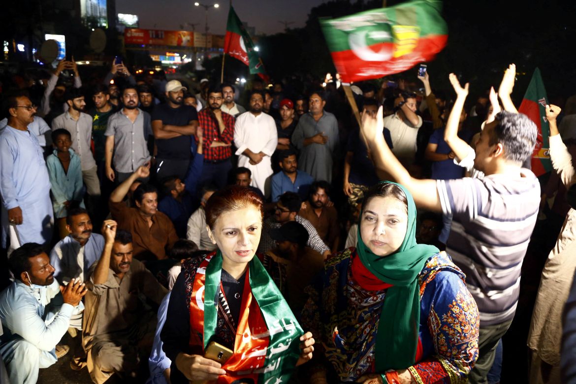 Supporters of Pakistan former Prime Minister Imran Khan, react following the shooting incident on his long march in Wazirabad