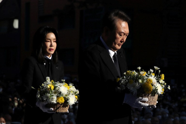 South Korean President Yoon Suk-yeol and his wife Kim Keon-hee attend a Buddhist ceremony commemorating the victims of a crowd crush that happened during Halloween festivities.
