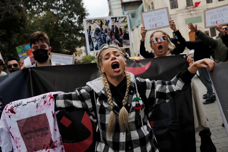 Demonstrators attend a protest in support of Iranian women and against the death of Mahsa Amini, near the Iranian consulate in Istanbul, Turkey