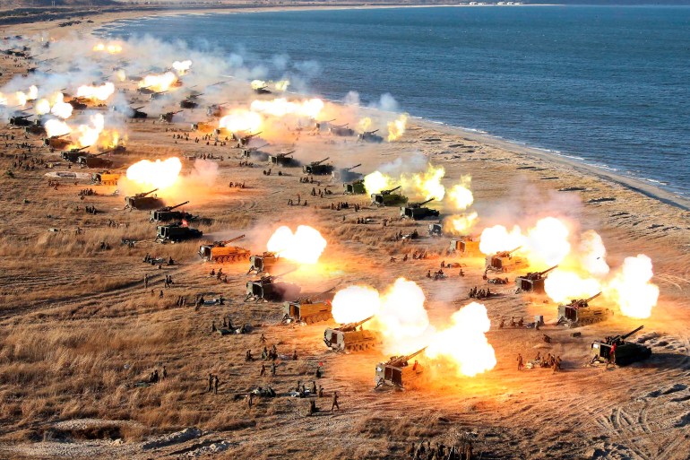 A drill by multiple North Korean artillery units along a beach.