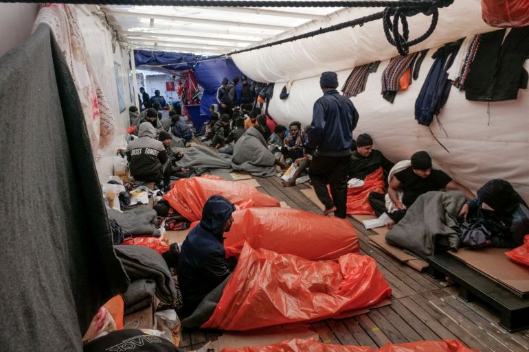 Rescued passengers sleep on the deck of the NGO rescue ship 'Ocean Viking', in the Mediterranean Sea