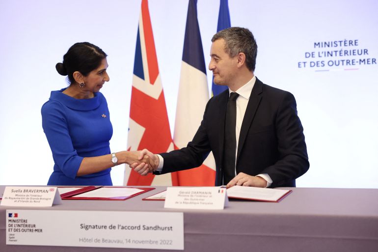 French Interior Minister Gerald Darmanin and Britain's Home Secretary Suella Braverman sign a joint declaration signature at the Hotel Beauvau Interior Ministry in Paris