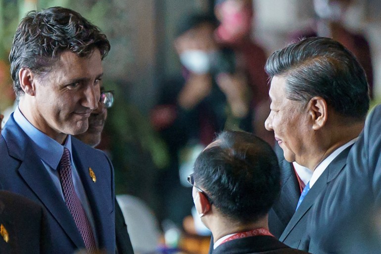 Justin Trudeau conversa com Xi Jinping