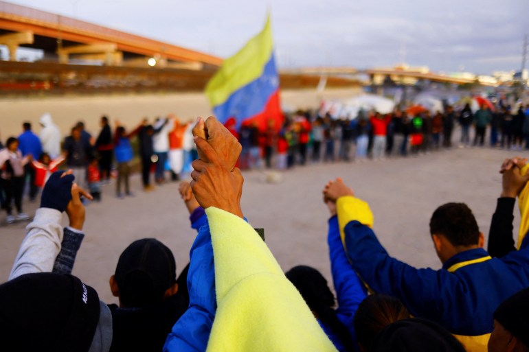 Venezuelan refugees and asylum seekers pray at US-Mexico border