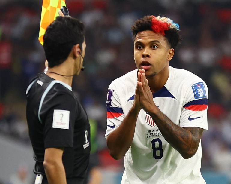 Weston McKennie of the U.S. remonstrates with the assistant referee