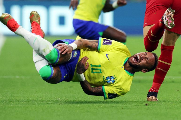 Brazil's Neymar reacts after a challenge from Serbia'a Sasa Lukic