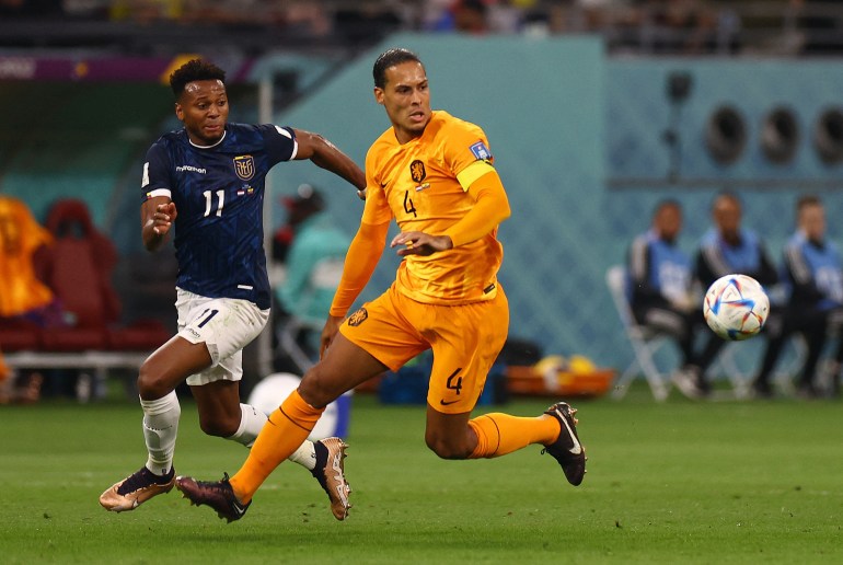 Netherlands' Virgil van Dijk in action with Ecuador's Michael Estrada