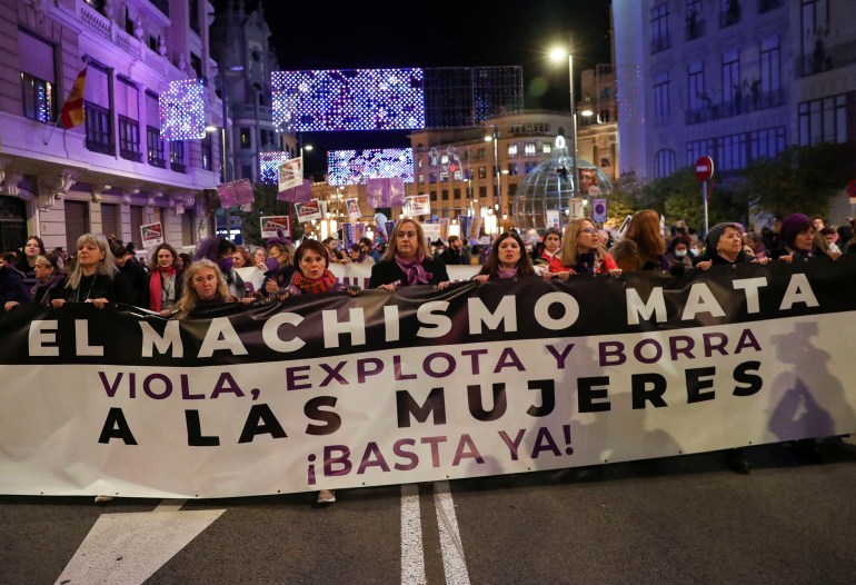 Demonstrators take part in a protest to mark the International Day for the Elimination of Violence against Women in Madrid