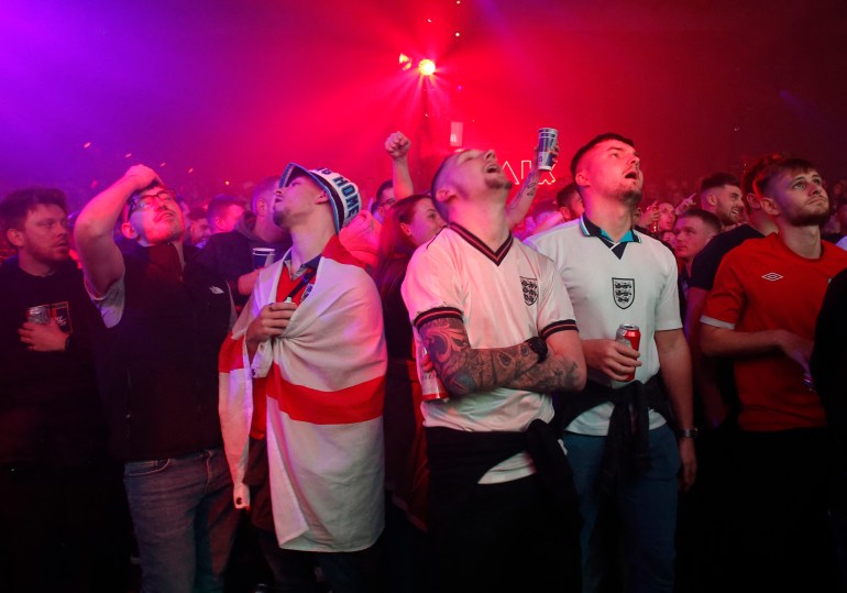 Fans in Manchester watch the England vs United States football match.