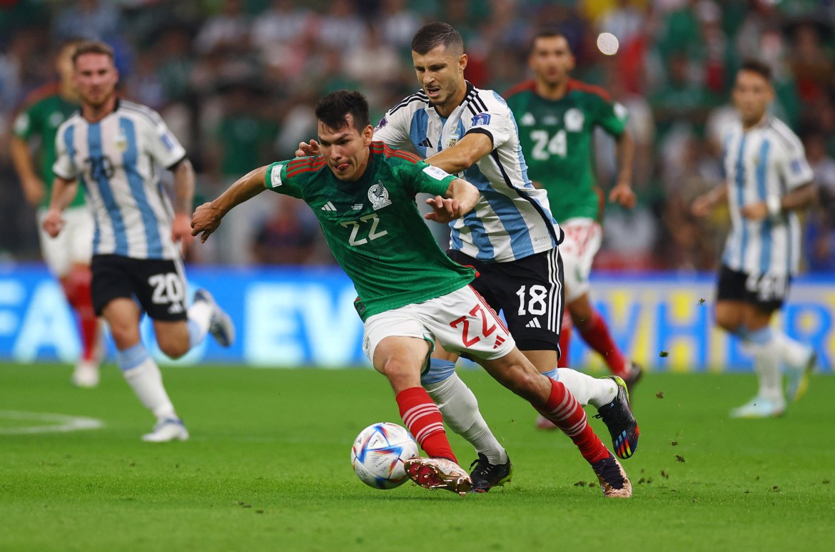 Mexico's Hirving Lozano in action with Argentina's Guido Rodriguez