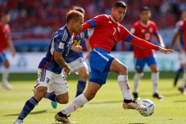 Costa Rica's Anthony Contreras in action with Japan's Yuto Nagatomo