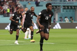 Canada&#39;s Alphonso Davies celebrates scoring the country&#39;s first-ever goal at a World Cup in their match against Croatia on November 27, 2022, in Qatar [Carl Recine/Reuters]