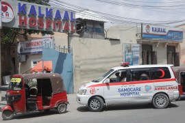 A Samocare ambulance carrying an unidentified wounded person drives into the Kalkaal Hospital in Mogadishu, Somalia [Feisal Omar/Reuters]