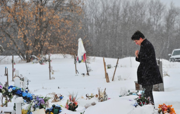 Trudeau pays respects at graves of victims of deadly Saskatchewan stabbing spree, in James Smith Cree Nation.