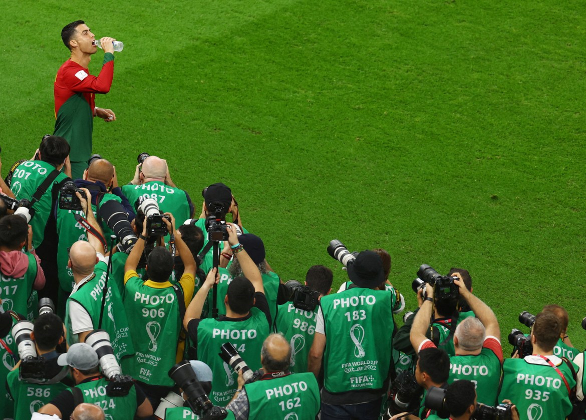 Portugal's Cristiano Ronaldo and photographers on the pitch before the match.