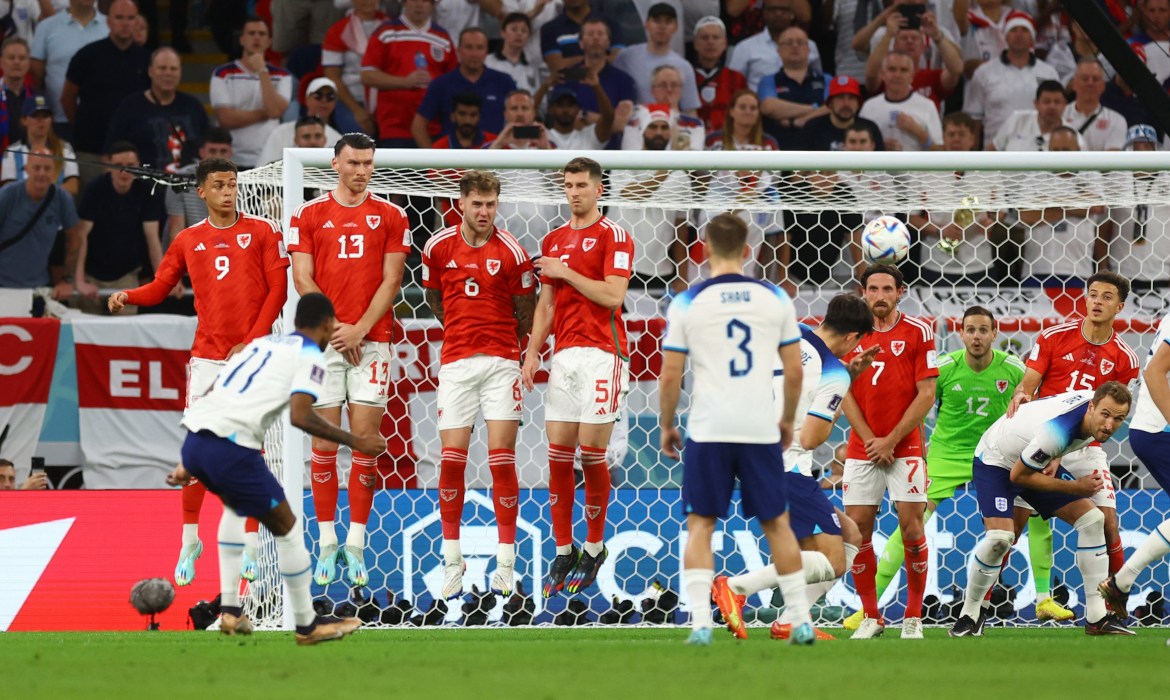 England's Marcus Rashford scores their first goal from a free kick