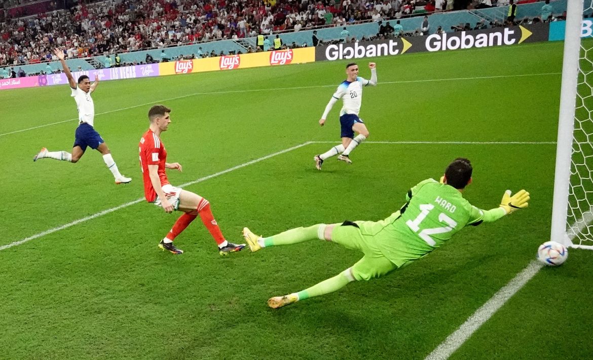 England's Phil Foden scores their second goal past Wales' Danny Ward