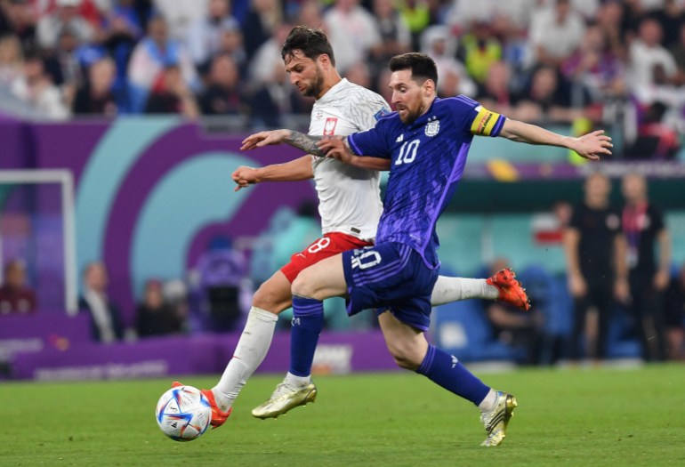 Argentina's Lionel Messi in action with Poland's Bartosz Bereszynski
