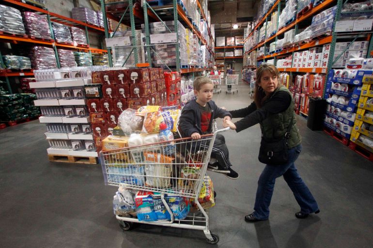 Tina VanPelt and her son Soloman, 4, shop at a Costco store, in, Portland, Ore.