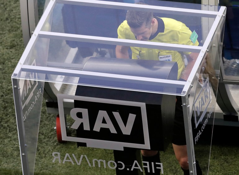 In this Friday, June 22, 2018 file photo, referee Matt Conger from New Zealand watches the Video Assistant Referee system, known as VAR during the group D match between Nigeria and Iceland at the 2018 World Cup in the Volgograd Arena in Volgograd, Russia.