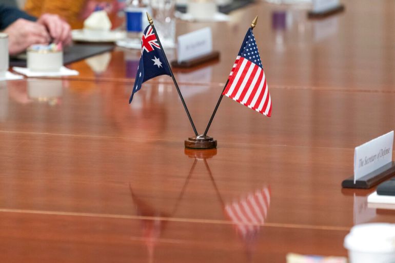 The Australian and American flags are displayed on the table during a meeting with Secretary of Defense Lloyd Austin and Deputy Prime Minister of Australia and Minister for Defense Richard Marles at the Pentagon, in July 2022 [File: Alex Brandon/AP]