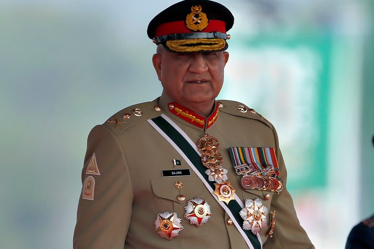 FILE - Pakistan's Army Chief General Qamar Javed Bajwa arrive to attend a military parade to mark Pakistan National Day in Islamabad, Pakistan, Wednesday, March 23, 2022. Officials say Pakistan’s powerful army chief in a rare move this week, Saturday, July 30, contacted Washington, urging U.S. authorities to use their influence to secure an early release of a key $1.7 billion installment from the International Monetary Fund. The latest development comes as Islamabad struggles to stave off a deepening economic crisis. (AP Photo/Anjum Naveed, File)