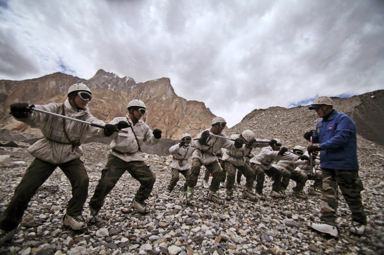 FILE- Indian army soldiers undergo a training session at the Siachen base camp, in Indian Kashmir on the border with Pakistan, July 19, 2011. The remains of an Indian army soldier have been found more than 38 years after he went missing on a glacier at the highest point along the heavily militarized disputed border between India and Pakistan in Kashmir, officials said Wednesday.