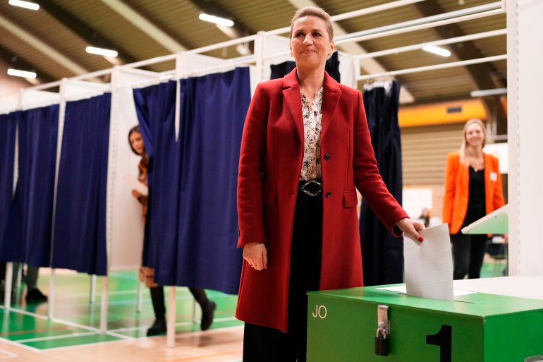 Danish Prime Minister Mette Frederiksen casts her ballot at a polling station in Hareskovhallen in Vaerloese