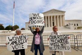 Pro-abortion rights demonstrators hold signs outside of the US Supreme Court