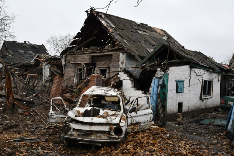 A damaged Soviet-era Ukrainian car "Zaporozhets" is seen next to a destroyed apartment building after Russian shelling in Pokrovsk, Donetsk region, Ukraine