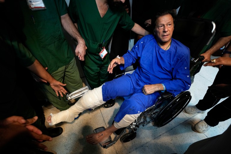 Former Pakistani Prime Minister Imran Khan leaves after a news conference in Shaukat Khanum hospital, where is being treated for a gunshot wound in Lahore, Pakistan
