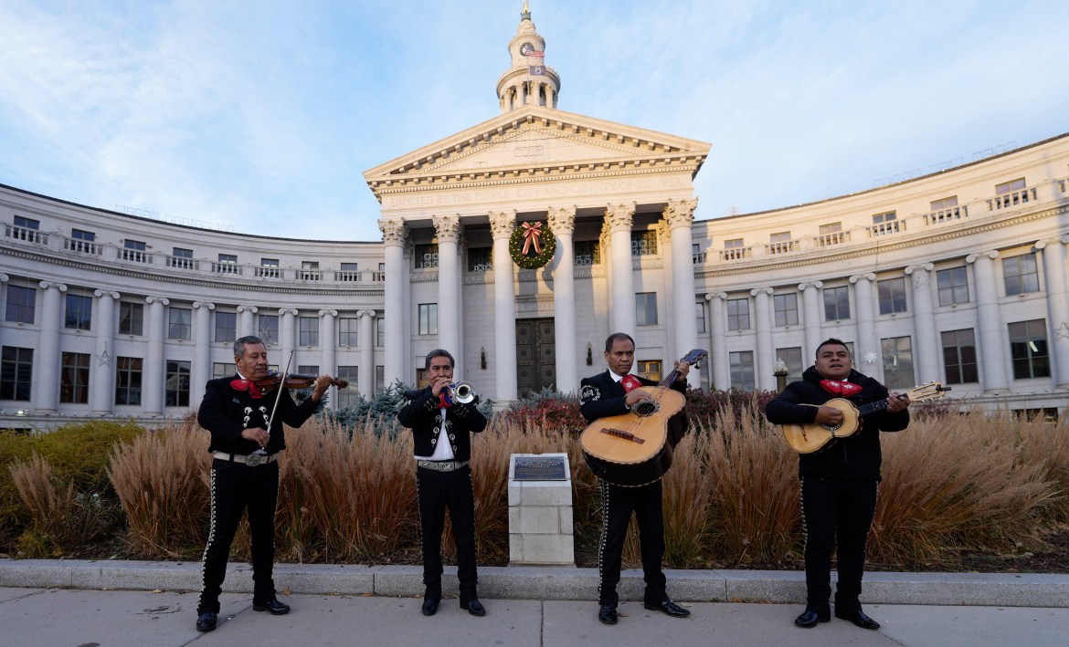 Members of Mariachi America perform outside the City County Building