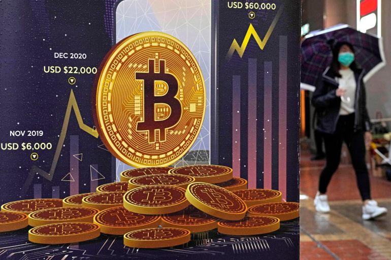 An advertisement for Bitcoin cryptocurrency is displayed on a street in Hong Kong