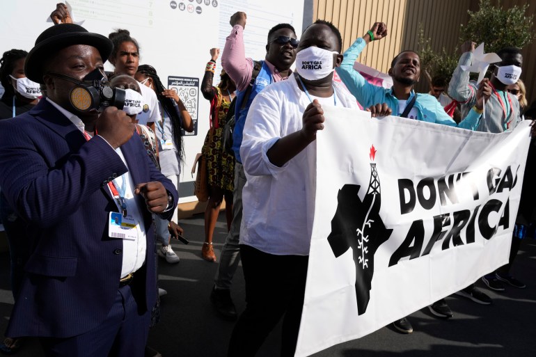 Demonstrators participate in a don't gas Africa protest at the COP27 U.N. Climate Summit, Tuesday, Nov. 15, 2022, in Sharm el-Sheikh, Egypt. (AP Photo/Peter Dejong)