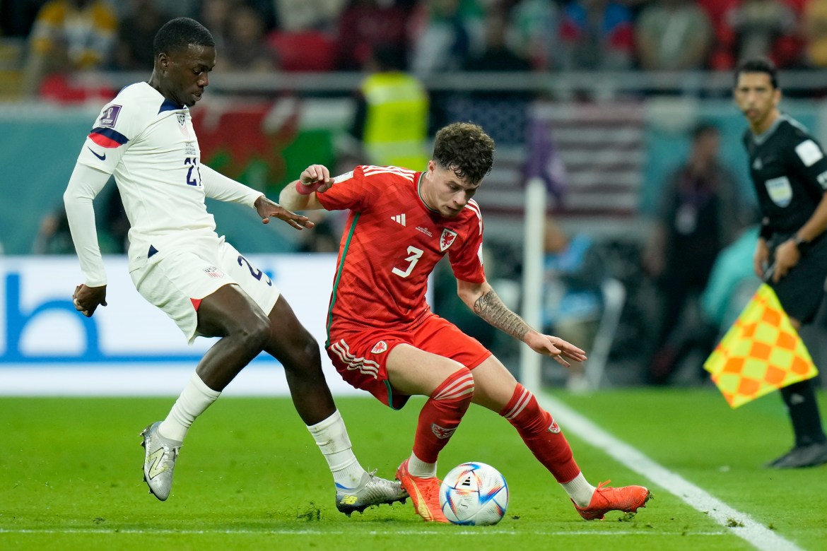 Tim Weah of the United States, left, vies for the ball with Wales' Neco Williams