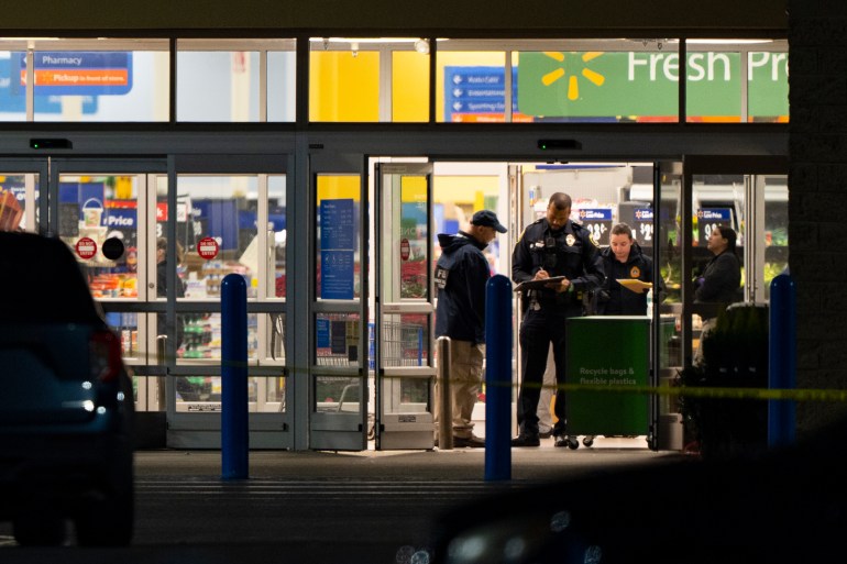 Law enforcement, including the FBI, work at the scene of a mass shooting at a Walmart, Wednesday, Nov. 23, 2022, in Chesapeake, Va. (AP Photo/Alex Brandon)