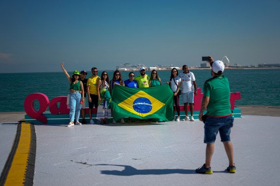 Brazil's soccer team fans have their photo taken along the Doha corniche in Qatar