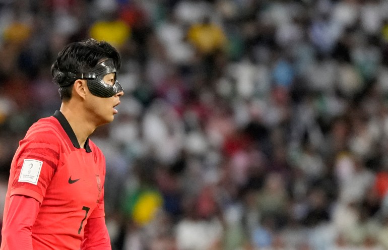 South Korea's Son Heung-min looks out during the World Cup group H soccer match between Uruguay and South Korea, at the Education City Stadium in Al Rayyan , Qatar, Thursday, Nov. 24, 2022. (AP Photo/Lee Jin-man)