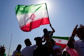 The Islamic Republic&#39;s flag consists of three horizontal bands in red, white and green with the word &#39;Allah&#39; appearing in stylised script in the middle [Jin-Man Lee/AP Photo]