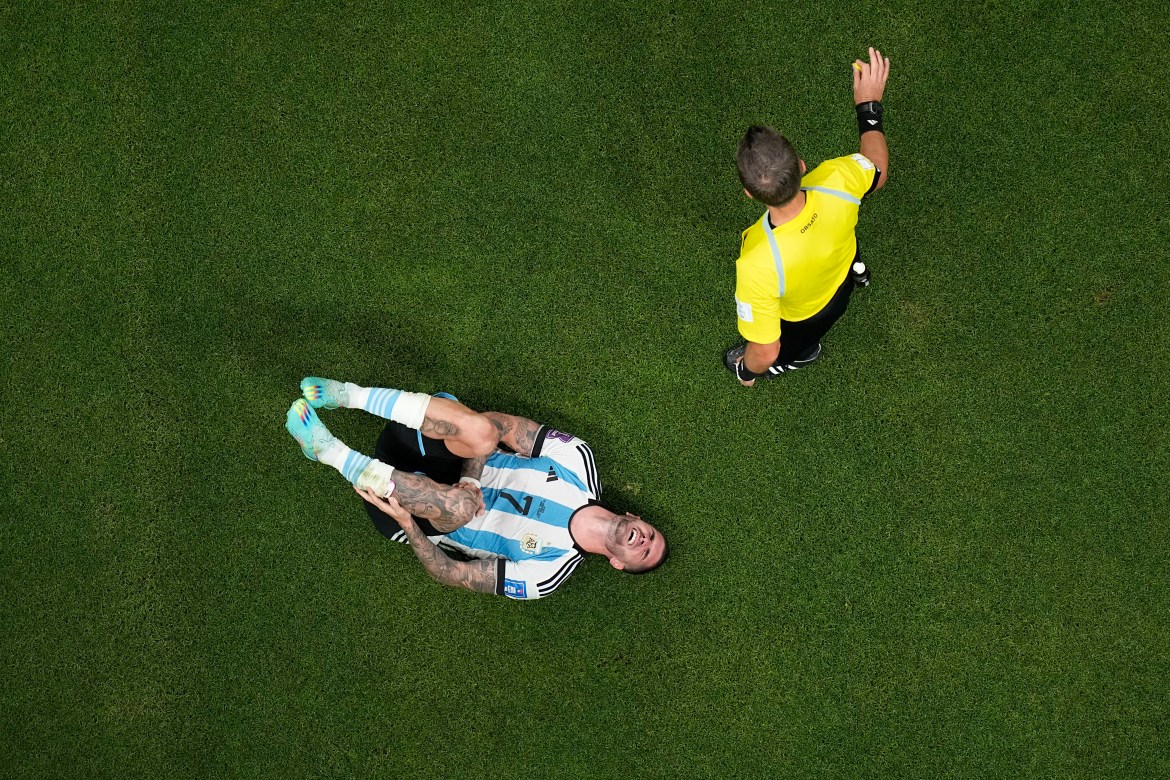 Argentina's Rodrigo De Paul reacts next to referee