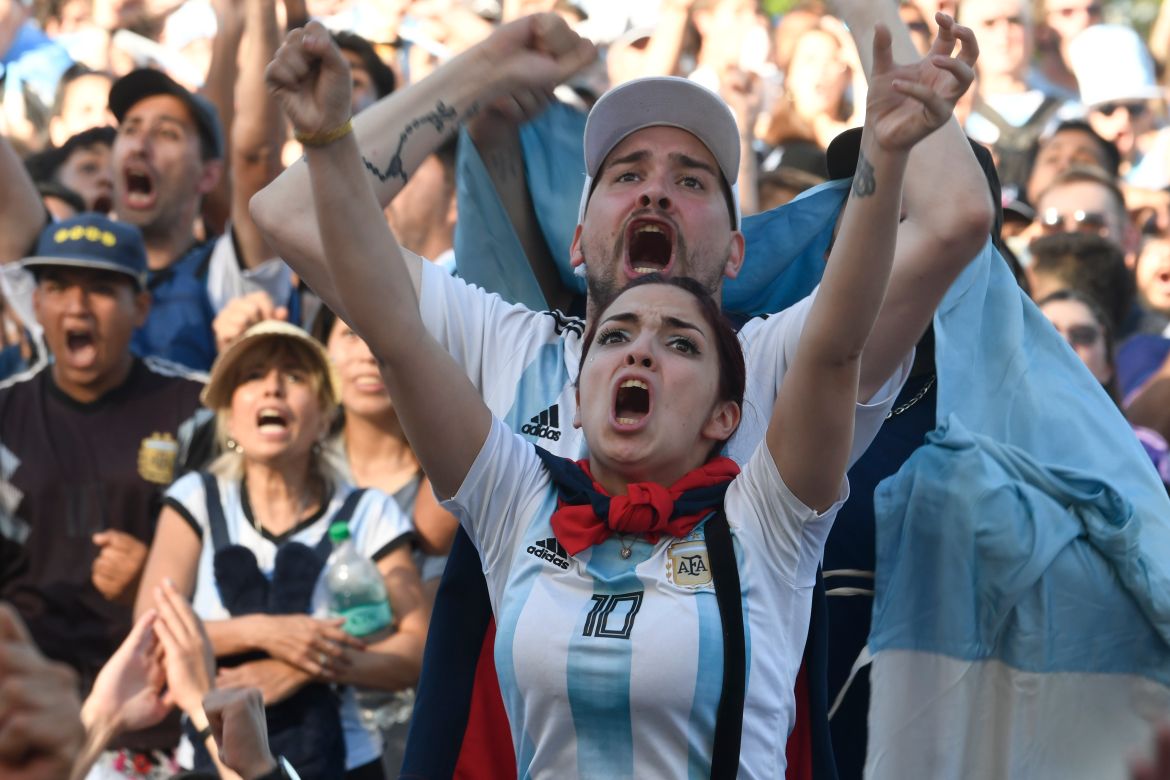 Argentina football fans react as they watch their team's match against Mexico at the World Cup, hosted by Qatar, in Buenos Aires, Argentina