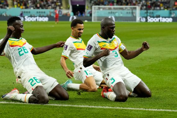 Senegal's Kalidou Koulibaly, right, celebrates with teammates scoring his side's second