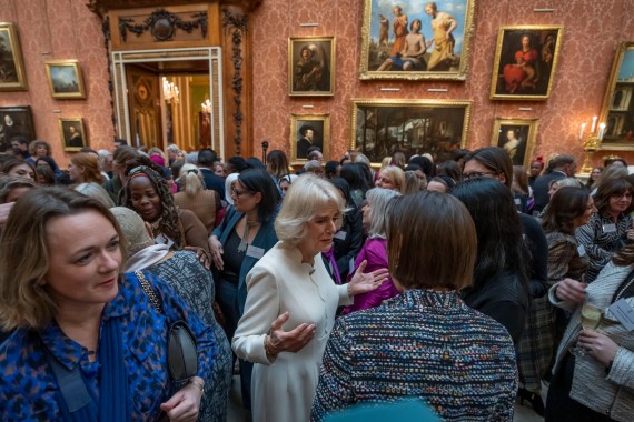 Britain's Camilla, the Queen Consort, center, attends a reception to raise awareness of violence against women and girls as part of the UN 16 days of Activism against Gender-Based Violence