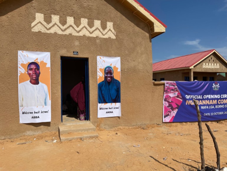 Un portrait d'Abba orne l'entrée de sa maison à Ngarannam, Borno [Festus Iyorah/Al Jazeera]