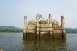 A photo of a sunk building, maybe a mosque.
