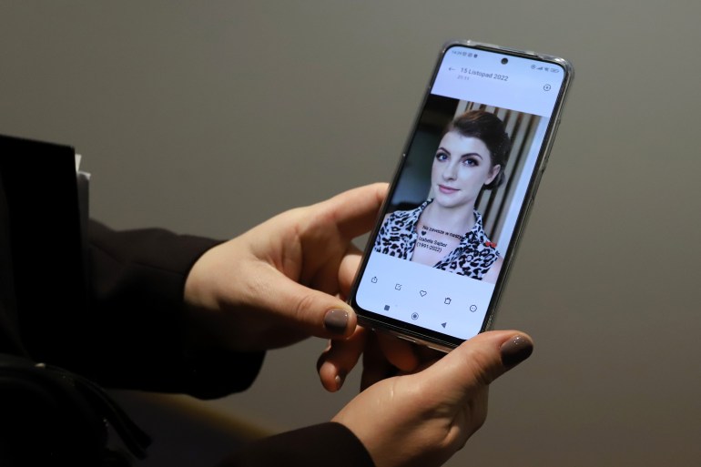 Barbara Skrobol, sister in law of Izabela Sajbor, the first known victim of the de facto abortion ban in Poland, shows a picture of Izabela on her phone at the European Parliament headquarters in Brussels,