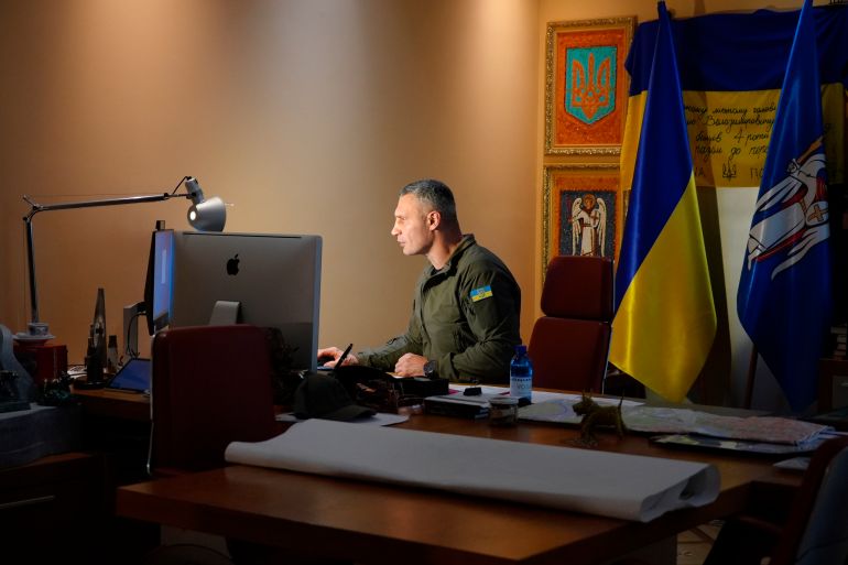 Kyiv Mayor Vitali Klitschko works at his desk in his City Hall office in the Ukrainian capital